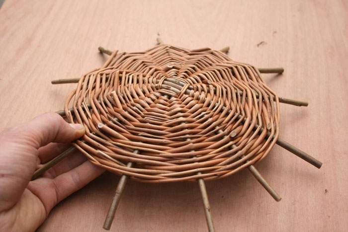 Basket Weaving around a wooden Base and Flower Sticks